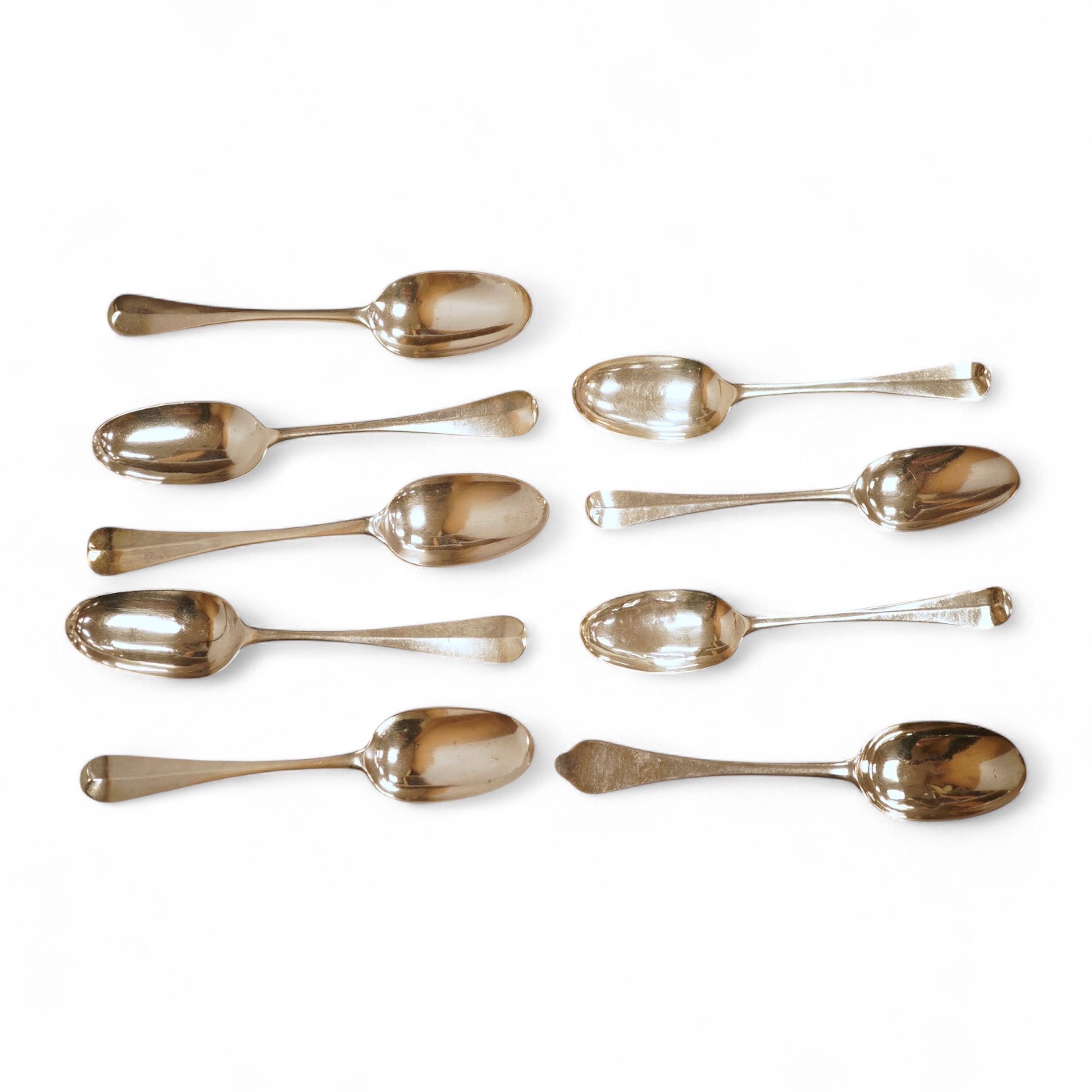 An 18th century Irish? provincial silver Hanoverian pattern tablespoon, maker's mark stamped twice 'I.T with crown above and mullet below' and 'Sterling', 20.9cm, together with eight assorted 18th century silver rat tail